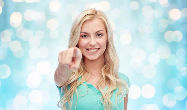 Happy young woman pointing finger to you — Stock Photo, Image