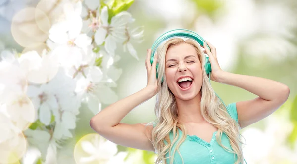 Happy young woman or teenage girl with headphones — Stock Photo, Image