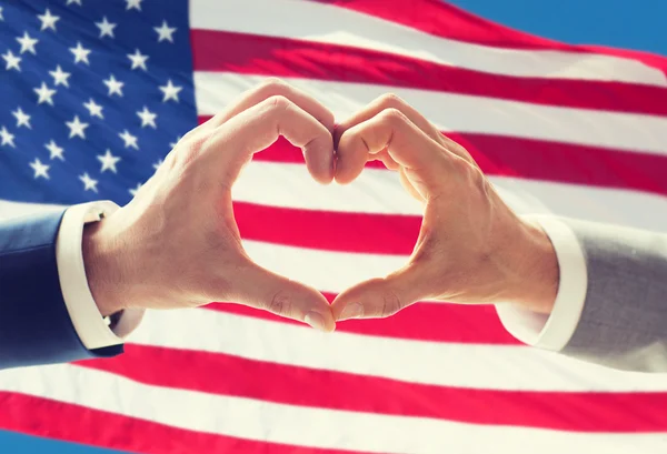 Close up of male gay couple hands showing heart — Stock Photo, Image