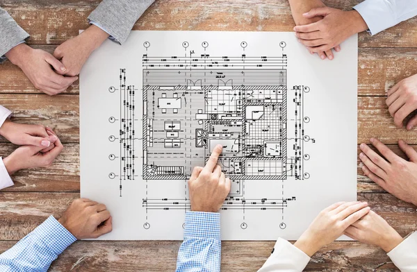 Close up of business group with blueprint — Stock Photo, Image