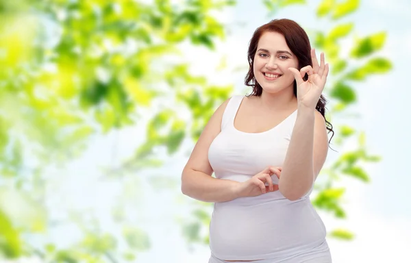 Plus size woman in underwear showing ok hand sign — Stock Photo, Image