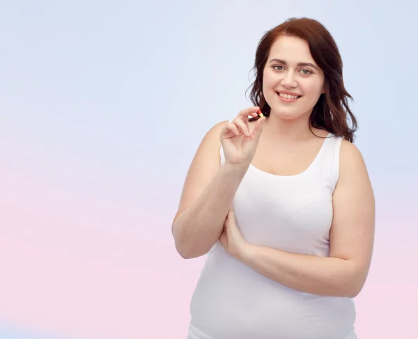 Glada plus size kvinna i underkläder med p-piller — Stockfoto
