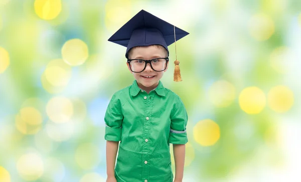 Happy boy in bachelor hat or mortarboard — Stock Photo, Image