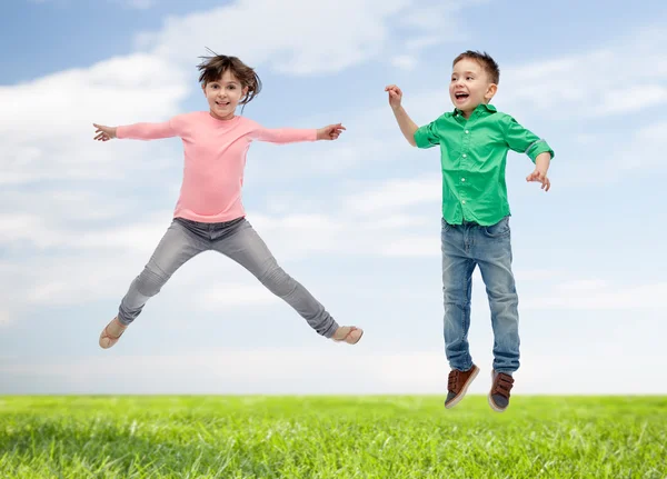 Happy little girl jumping in air — Stock Photo, Image