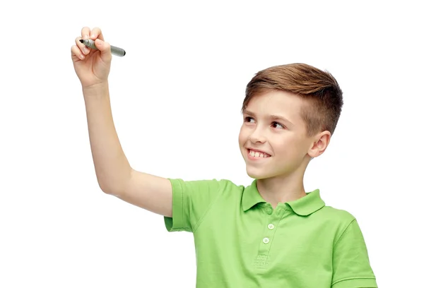 Happy boy in green t-shirt with marker writing — Stockfoto