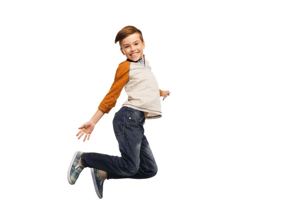 Szczęśliwy, uśmiechnięty chłopiec skoki w powietrzu — Zdjęcie stockowe
