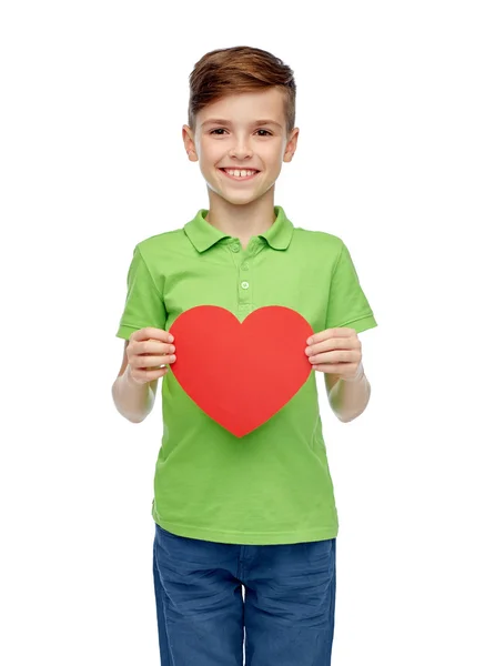 Happy boy holding red heart shape — Stockfoto