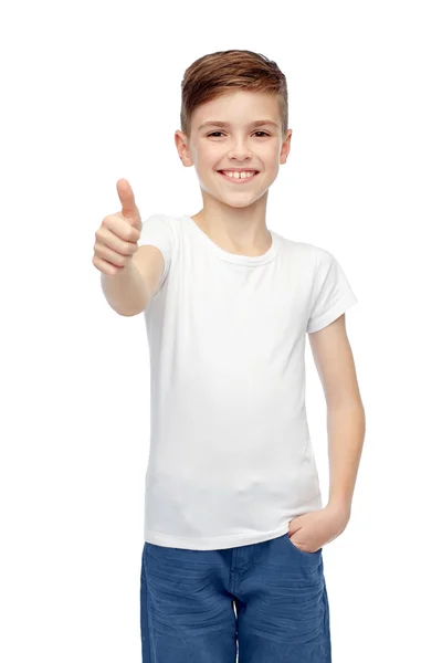 Happy boy in white blank t-shirt showing thumbs up — Stock Photo, Image