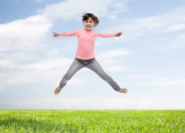 Felice bambina saltando in aria — Foto Stock