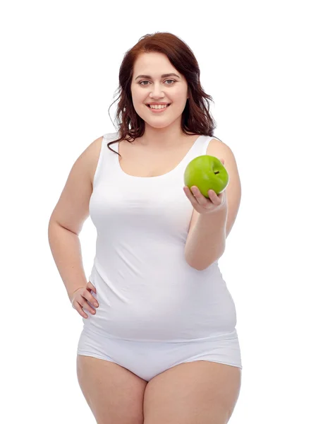 Happy plus size woman in underwear with apple — Stock Photo, Image