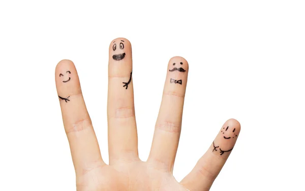 Close up of hands and fingers with smiley faces — Stock Photo, Image