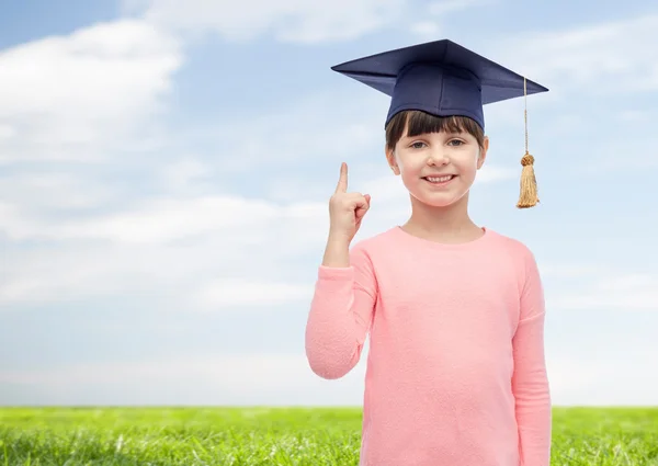 Happy girl in bachelor hat or mortarboard — Stock Photo, Image