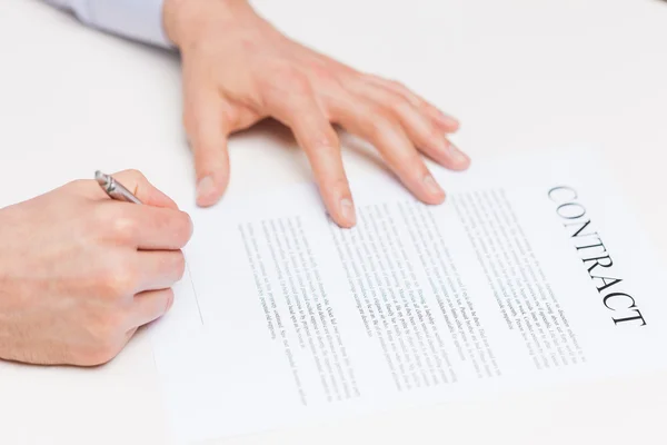 Close up of male hands signing contract document — Stock Photo, Image