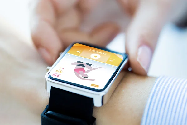 Close up of hands setting sport app on smartwatch — Stock Photo, Image