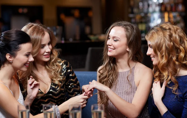 Woman showing engagement ring to her friends — Stock Photo, Image