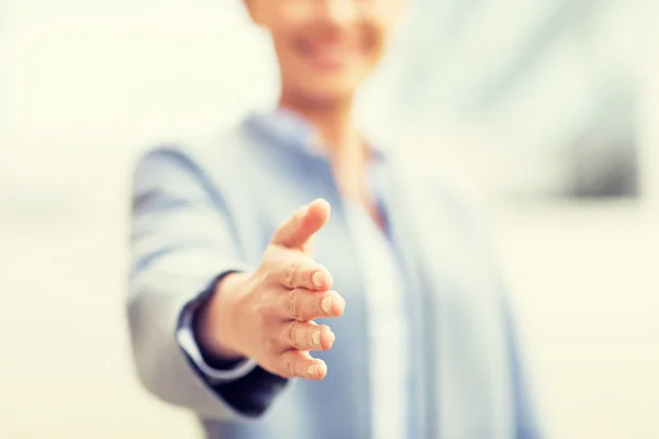 Close up of woman giving hand for handshake — Stockfoto