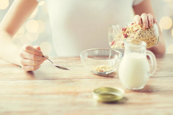 Close up of woman eating muesli for breakfast — Stock Photo, Image