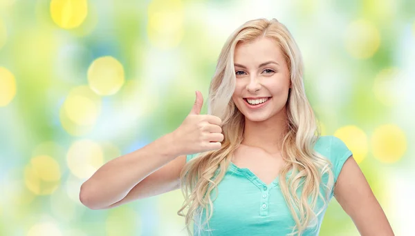 Щаслива жінка або дівчина-підліток показує великі пальці вгору — стокове фото