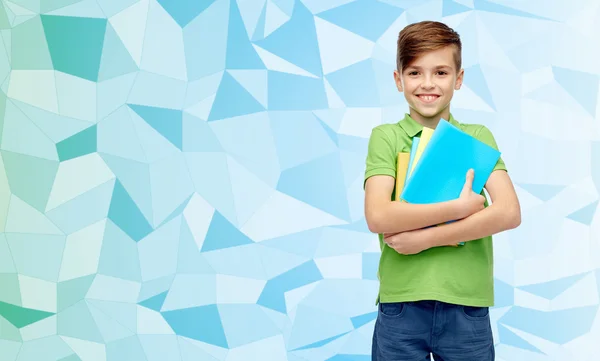 Niño estudiante feliz con carpetas y cuadernos —  Fotos de Stock