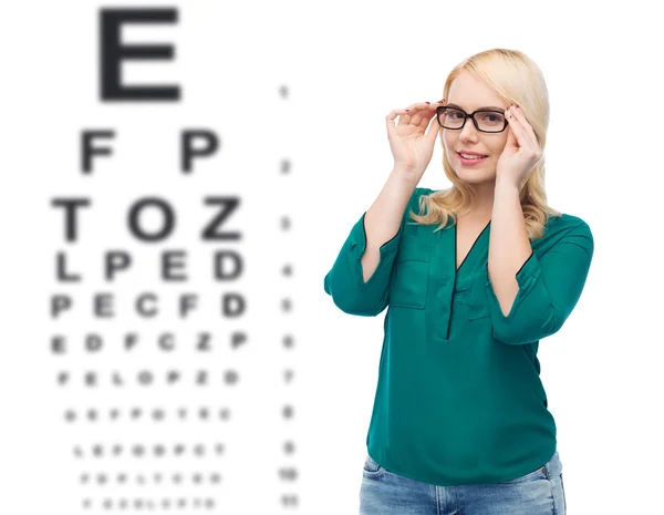 Smiling young woman with eyeglasses — Stock Photo, Image