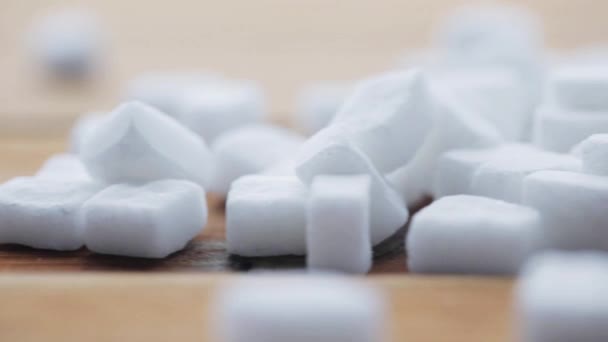 Close up of white sugar on wooden board or table — Stock Video