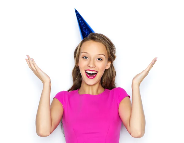 Happy young woman or teen girl in party cap — Stock Photo, Image