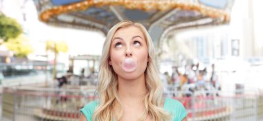 happy young woman or teenage girl chewing gum clipart