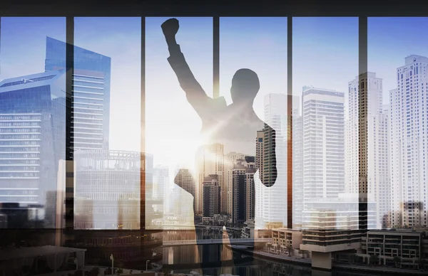 Silhouette of business man over city background — Stock Photo, Image
