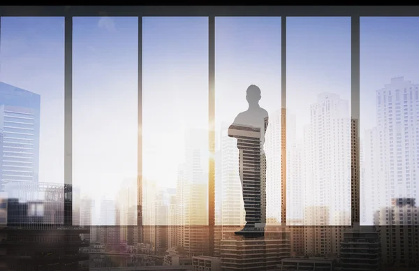 Silhouette eines Geschäftsmannes über Bürohintergrund — Stockfoto