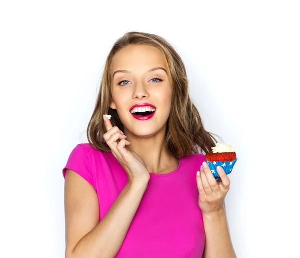 Happy woman or teen girl with birthday cupcake — Stock Photo, Image