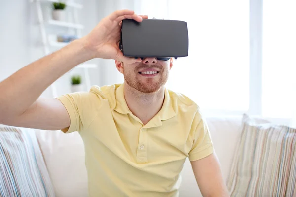Young man in virtual reality headset or 3d glasses Stock Image