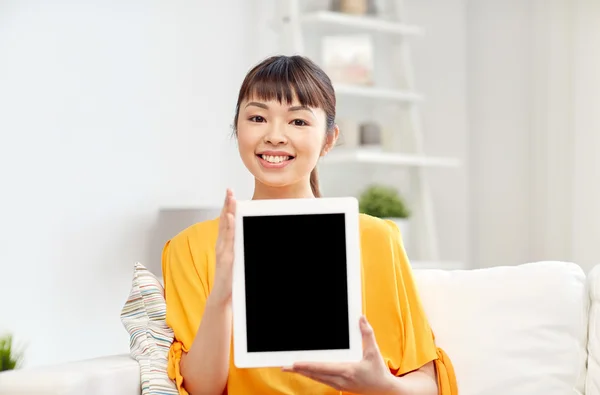 Happy young asian woman with tablet pc at home — Stock Photo, Image