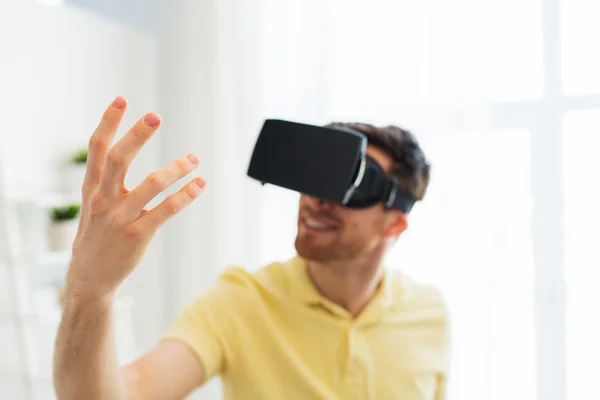 Young man in virtual reality headset or 3d glasses — Stock Photo, Image