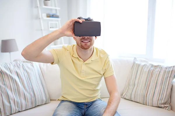 Young man in virtual reality headset or 3d glasses — Stock Photo, Image