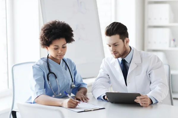 Two doctors meeting at hospital office — Stock Photo, Image