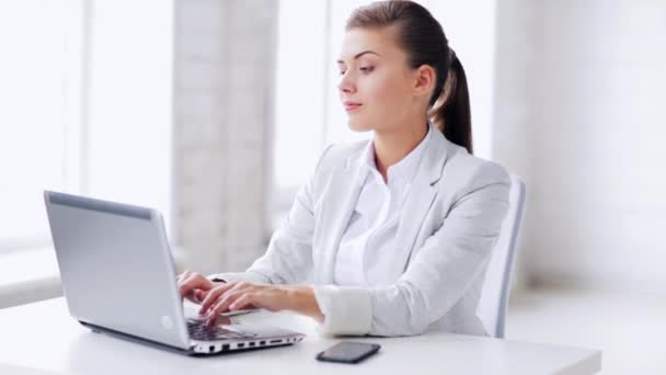 Attractive office worker taking phone call — Stock Video