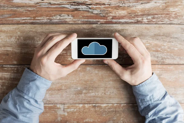 Close up of male hands with cloud on smartphone — Stock Photo, Image