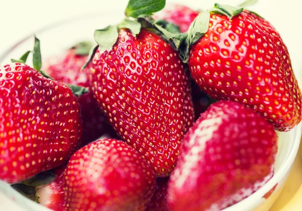 Close up of ripe red strawberries over white — Stock Photo, Image