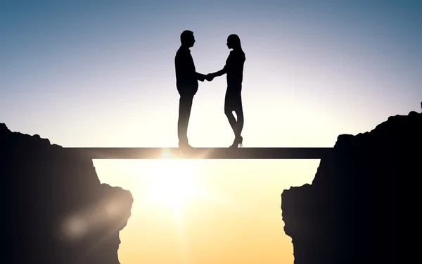 Business partners silhouettes shaking hands — Stock Photo, Image