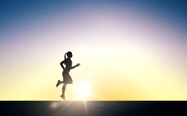 Happy young sports woman running outdoors Stock Photo