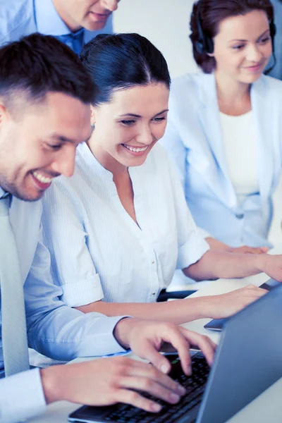 Group of people working with laptops in office — Stock Photo, Image