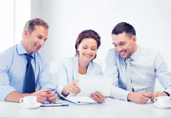 Business team looking at tablet pc in office — Stock Photo, Image
