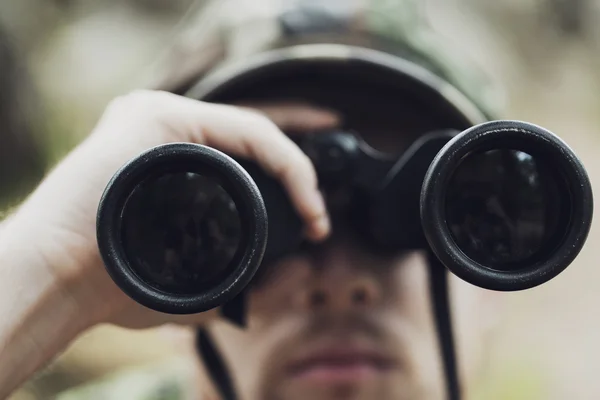 Close up of soldier or hunter with binocular — Stock Photo, Image