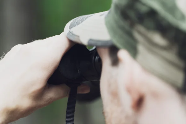 Close up of soldier or hunter with binocular — Stock Photo, Image