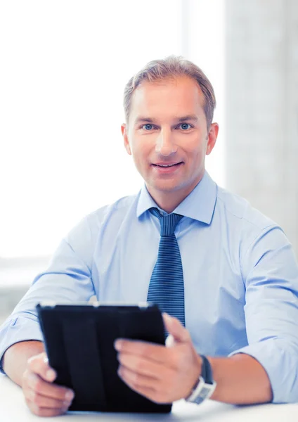 Businessman with tablet pc in office Royalty Free Stock Photos