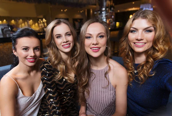 Happy smiling women taking selfie at night club — Stock Photo, Image