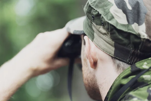 Close up of soldier or hunter with binocular — Stock Photo, Image
