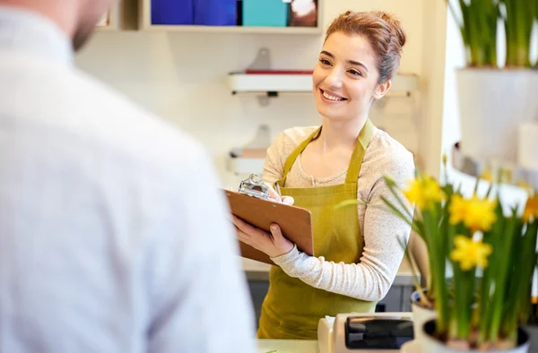 Florist woman and man making order at flower shop — Stock Photo, Image