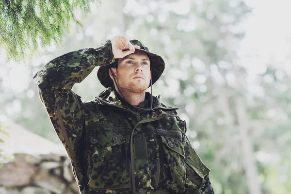 Young soldier or ranger in forest — Stock Photo, Image