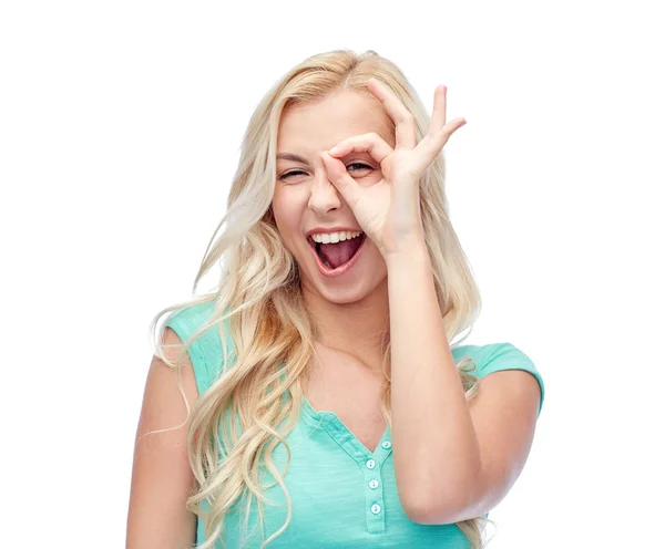 Young woman making ok hand gesture — Stock Photo, Image